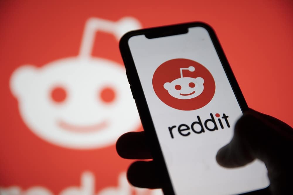 London, Uk - February 2021: Reddit Logo Displayed On A Smartphon